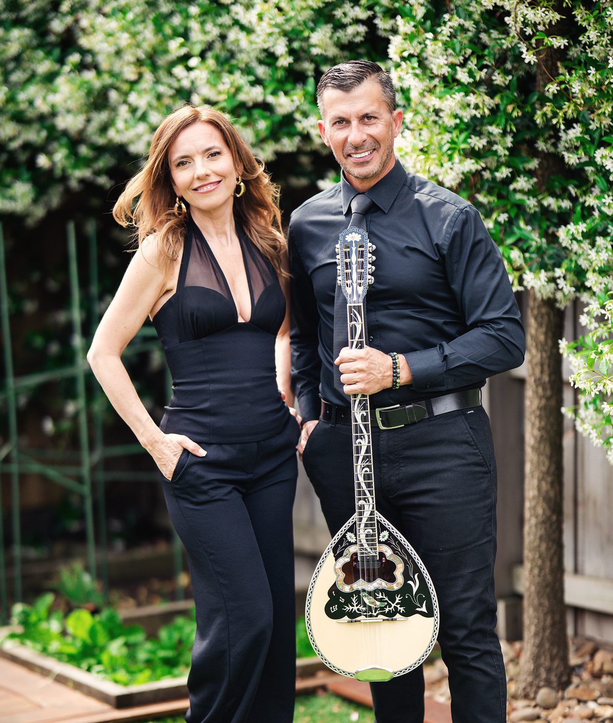 Aggie Gioftsidis and bouzouki player Dean performing outdoors, Greek wedding music Melbourne