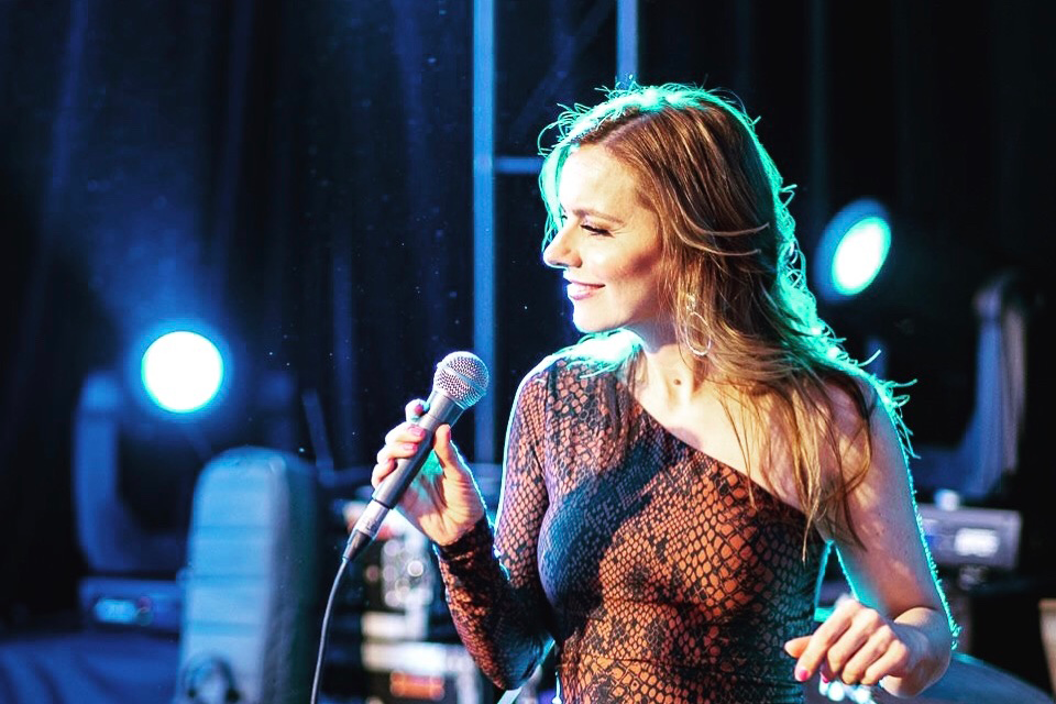 Aggie Gioftsidis performing live on stage in Melbourne