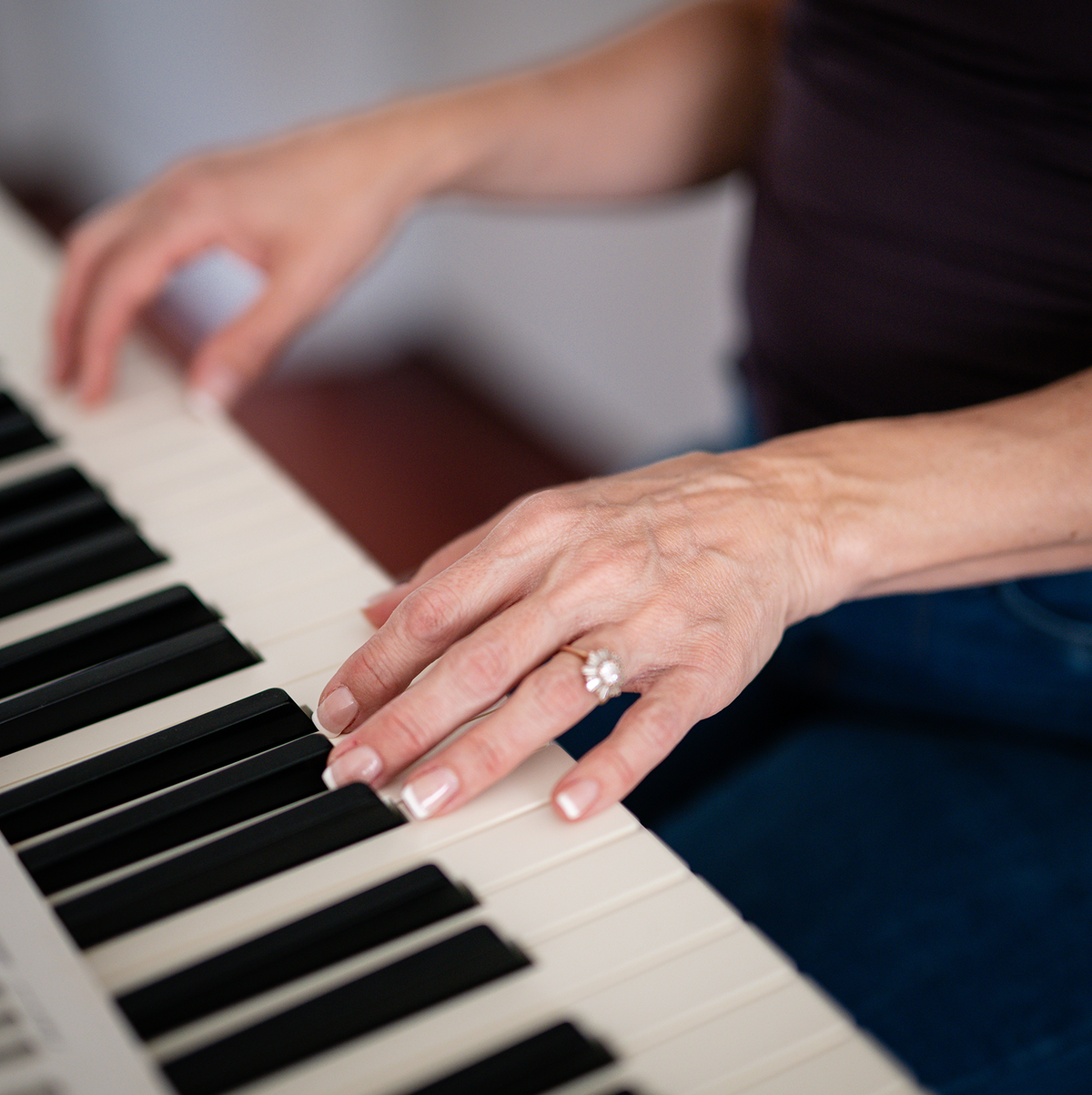 Hands on piano keys, piano lessons for singers in Melbourne